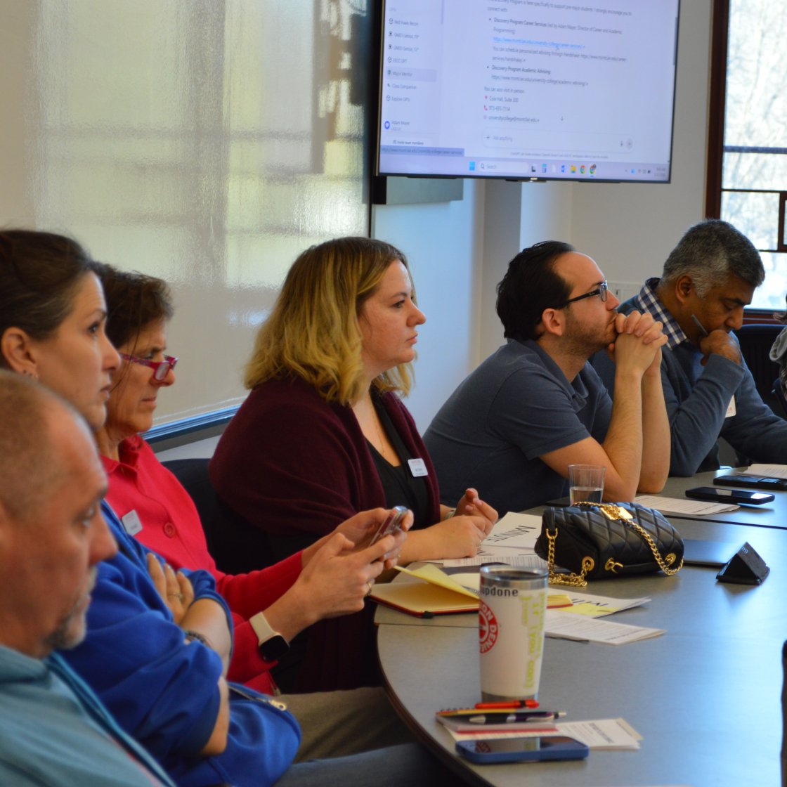 image of a group of people listening to a presentation