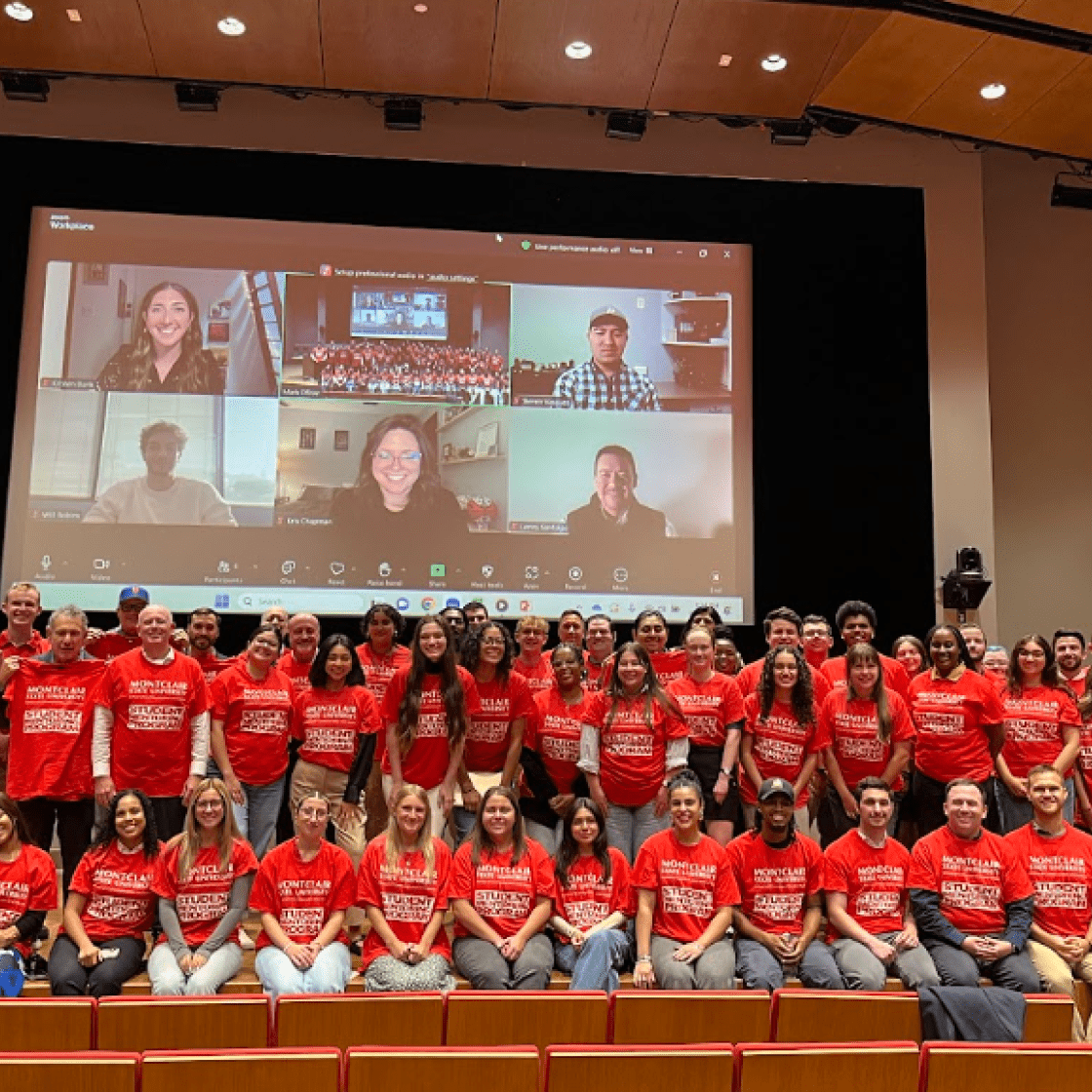 Group photo of mentoring program pairings in Presentation Hall.