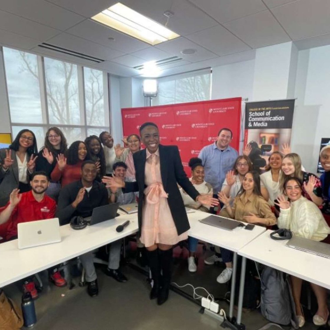 Students posing with NBC reporter.