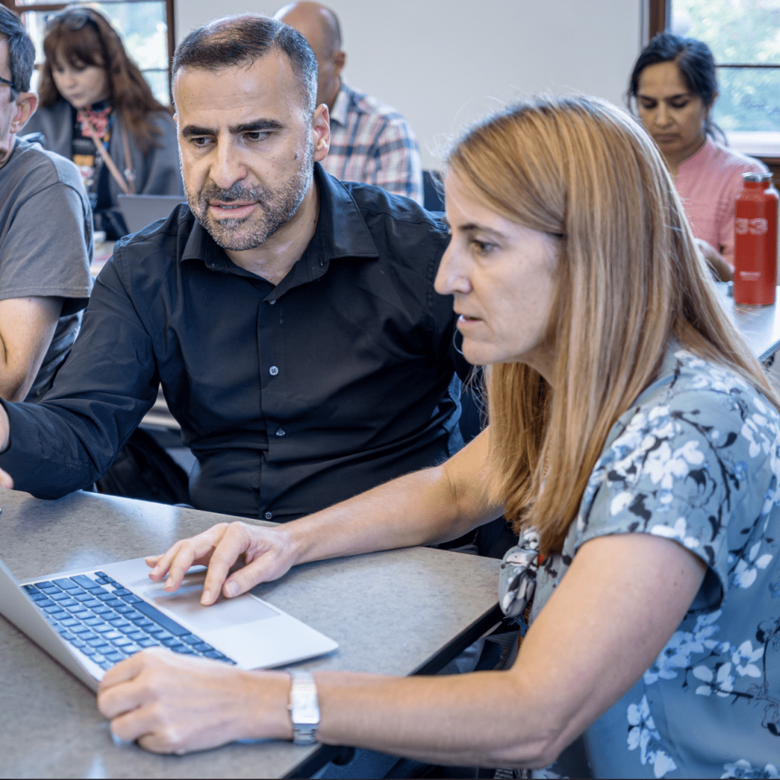 image of faculty and faculty developer working together