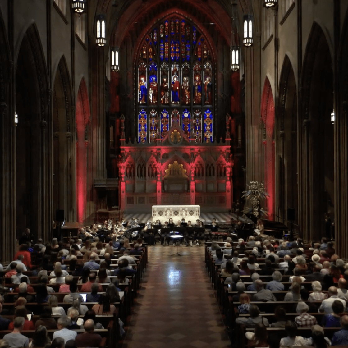 Trinity NYC with Cali School of Music Brass Musicians on stage