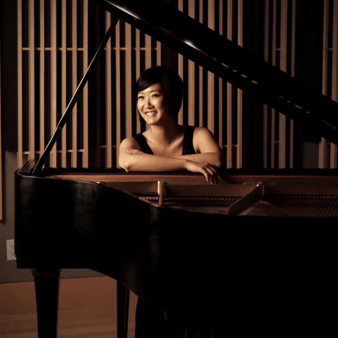 Soyeon Park Yoo headshot with piano