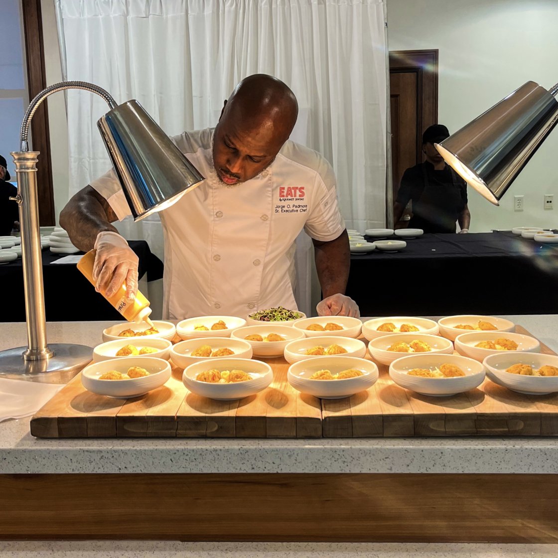 a chef infront of a food catering station