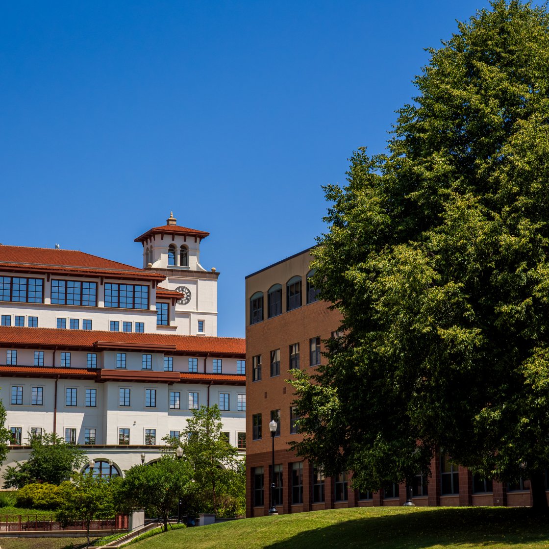 Dickson Hall and Business school with blue skies 