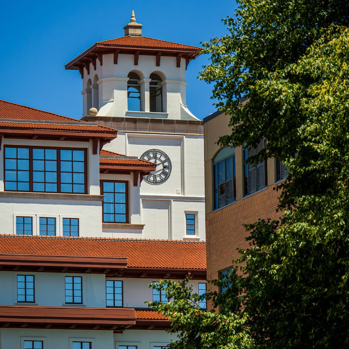 A white building with red roofing 