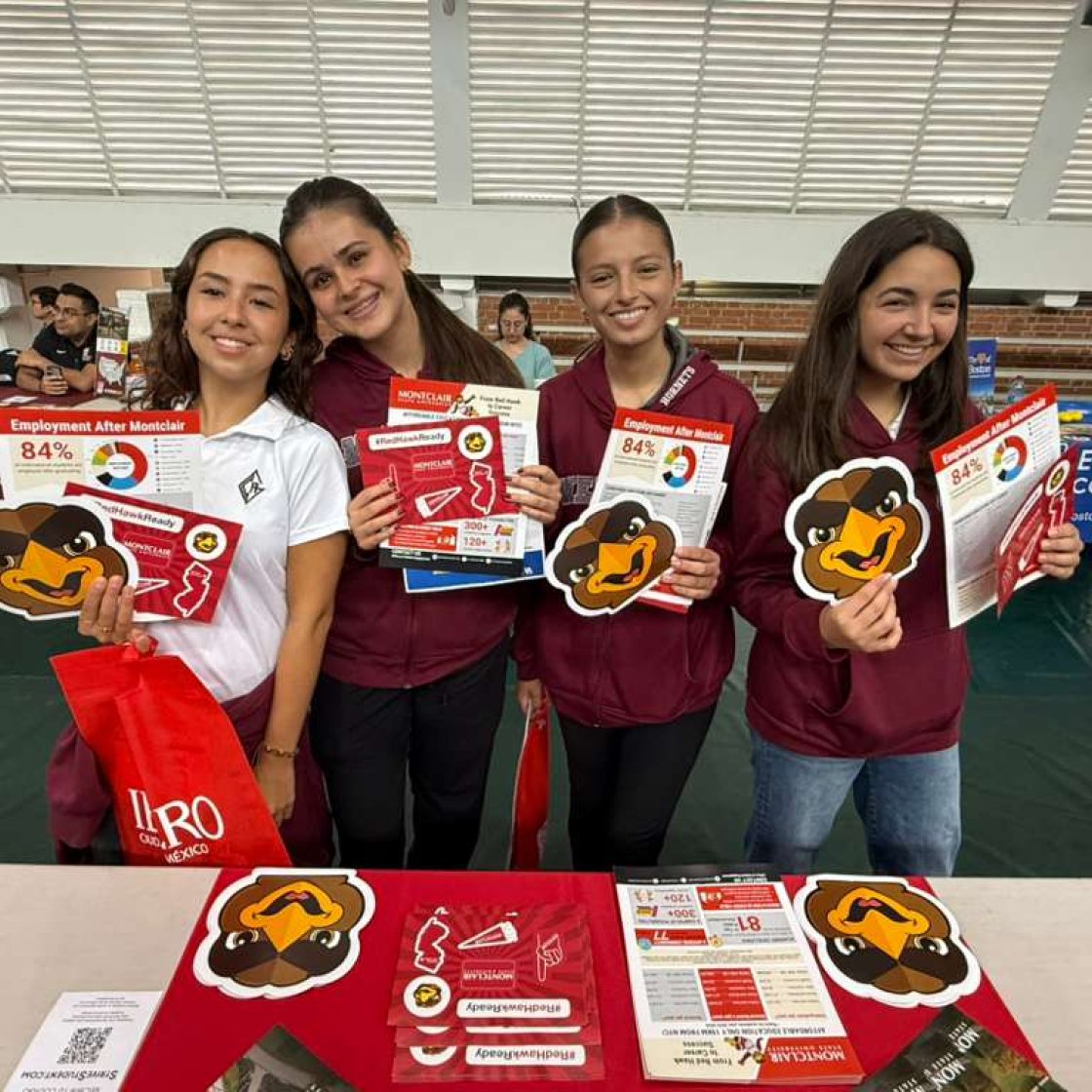 This image shows a group of students holding Montclair flyers.