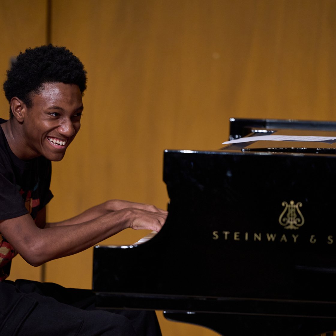 Cali Pathways student playing the piano