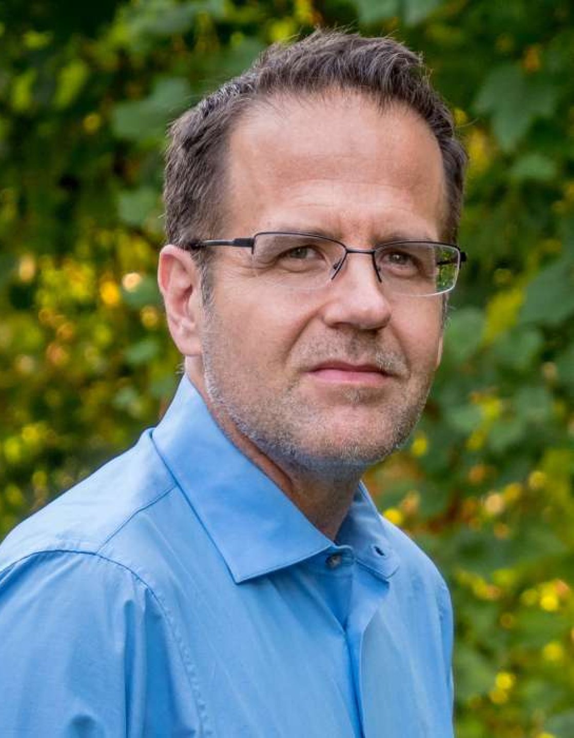 Headshot of Bond Benton, professor and department chair at the College of Communication and Media.