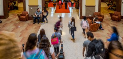 Students walking in Feliciano building atrium
