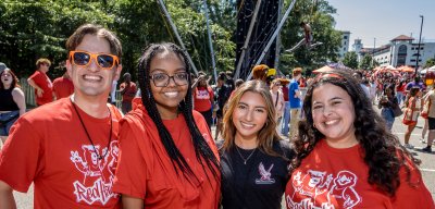 People posing for a photo on Red Hawk Day