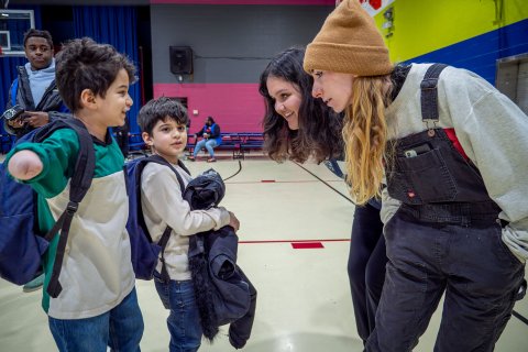Two Montclair State University AmeriCorps members, Sophia Civitella and Ema Halilovic, play with two children at the Paterson Boys and Girls Club during the University’s 9/11 Day of Service. (Photo by John J. LaRosa)