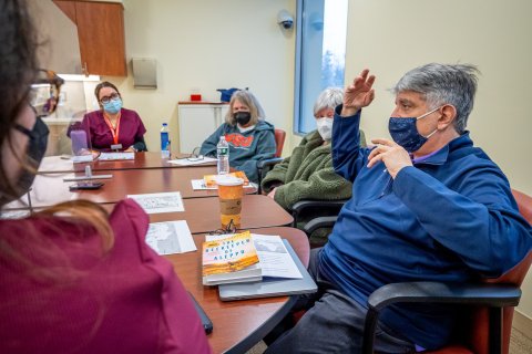 Members of the Aphasia Book Club seated around a table