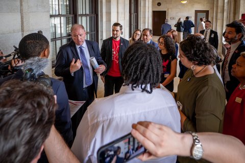 A state senator talks to a group of students, faculty and staff.