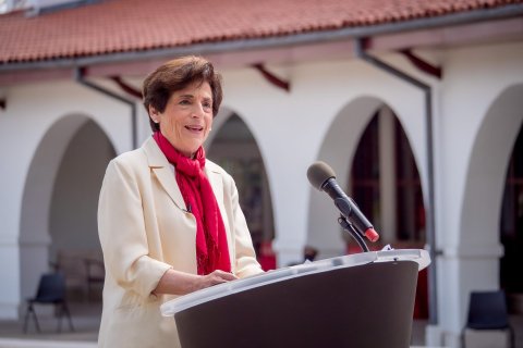 Photo of Montclair State University President Susan A. Cole at a lectern