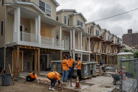 Montclair State University volunteers work together on a Habitat for Humanity home construction site in Paterson, NJ, as part of the 9/11 Day of Service and Remembrance.