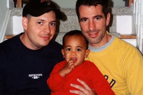 Peter Mercurio and Danny Stewart pose on stairwell with Kevin for family photo