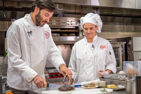 Montclair State University President Jonathan Koppell cooking at Sam's Diner