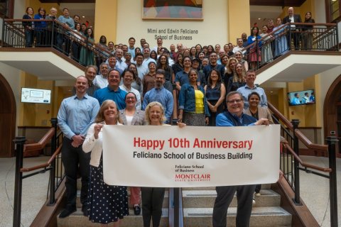 Feliciano faculty and staff group photo commemorating the 10 year anniversary