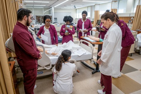 Nurses by a bed