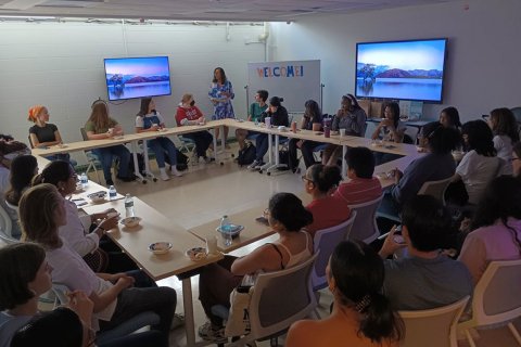 students in a classroom in a circle formation