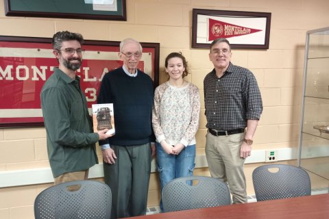 Left to right: Professor Jeffrey Gonzalez, Leon Zimmerman '59, Camille Zimmerman '27 (Leon's granddaughter), Archivist Paul Martinez