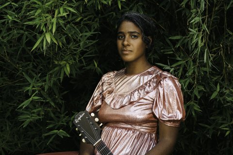 Leyla McCalla with guitar