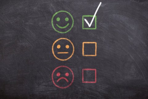 a checkmark next to a smiling image