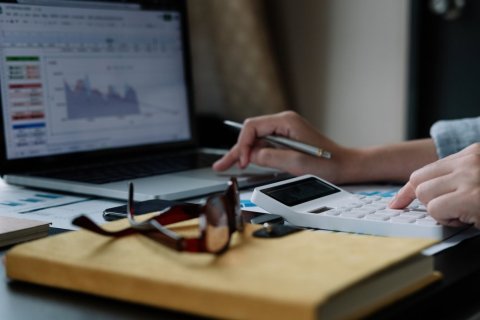 Image of calculator and laptop