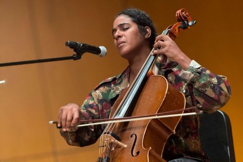 Leyla McCalla and cello on stage performing