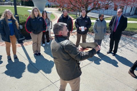 archivist paul martinez showing an image to the crowd