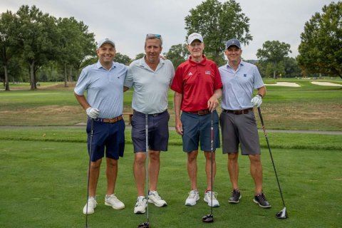 group of 4 men at the alumni golf outing 