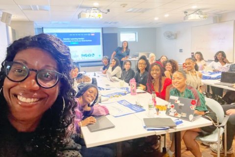 Dr. Michelle Burton selfie in classroom with visiting speaker Salerno