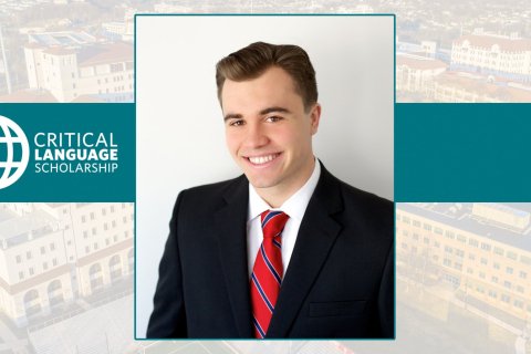 Portrait of a young man in a suit beside a logo for "Critical Language Scholarship"