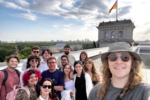 A group of college students posing for a selfie atop a German building