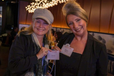 two women smiling at the NJEA gathering