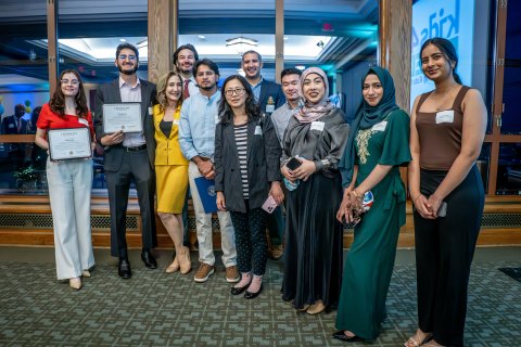 Group of students and professors posing at an event