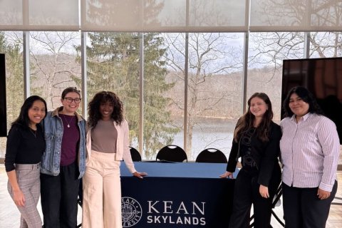 Students from Montclair and Kean pose for a group photo.