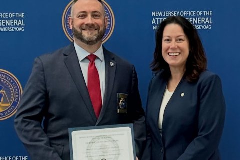 Chief Timothy Fox and NJ Attorney General Jennifer Davenport pose for a photo