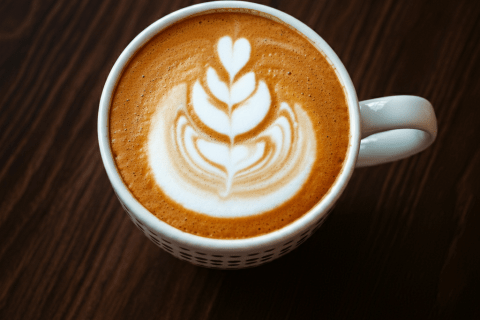 Birds eye view of a latte with a pretty foam design.