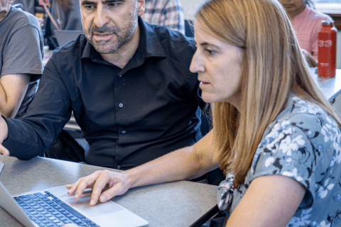image of faculty and faculty developer working together