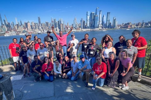Students and professor pose for a group photo at the Weehawken waterfront.