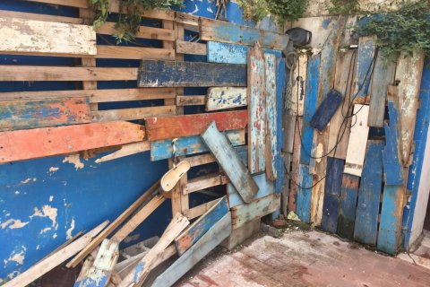 A dilapidated driftwood wall 