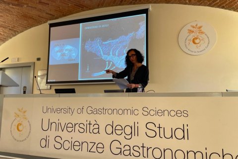 Dr. Teresa Fiore delivers a lecture to an audience