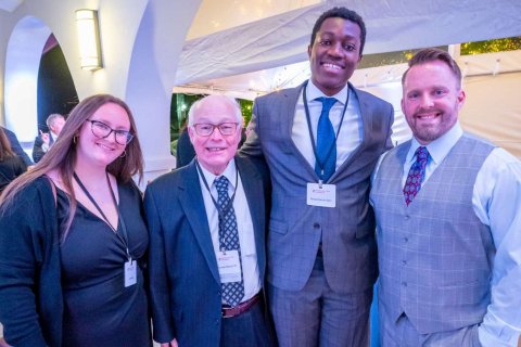 Kenneth Malmud ’76 (second from left), standing with Student Government Association (SGA) Treasurer Camryn Wade ’23 (left), SGA President Richard Steiner-Otoo (third from left) and Chris Fitzpatrick ’04, at the University’s Donor Celebration on campus in April.