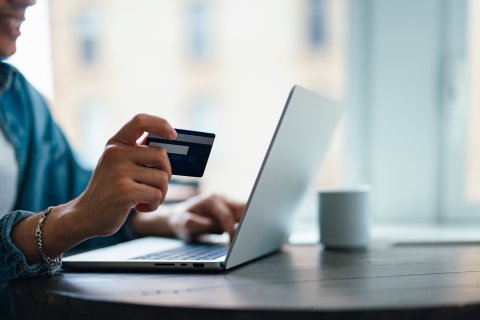 Photo of credit card and laptop 