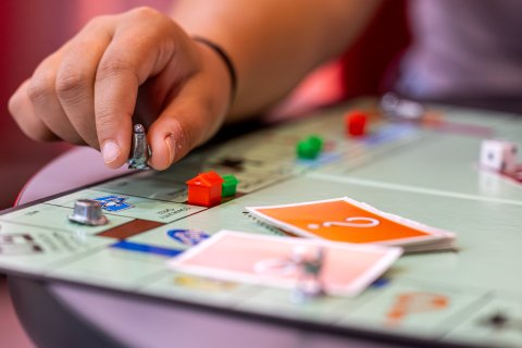 a person plays Monopoly