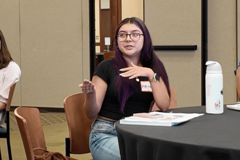 a student speaks at the summer induction retreat