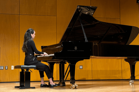 Piano student on stage performing