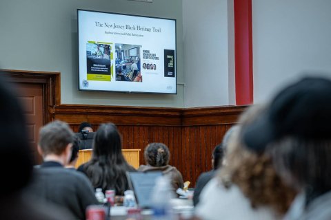 attendees viewing a powerpoint slide