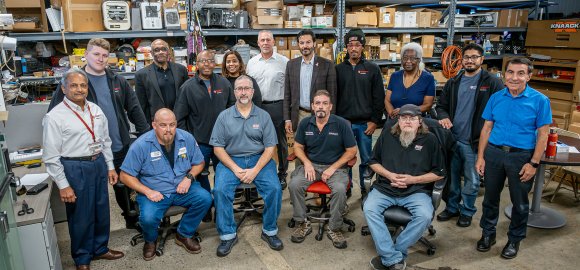 Montclair’s first cohort of Facilities apprentices are shown with their mentors, Facilities management and the University President. Seated from left, Keith Benjamin, Kevin Johnson, Patrick Hickey and Kevin Lepore. Standing from left, Rajendra Shah, David Lobefaro, Dwight Threepersons, Jhoan Noguiera, Shakira Jackson, Shawn Connolly, Montclair President Jonathan Koppell, Daniel Miller, Amy Ferdinand, Kevin Rizzo and Joseph Marzulla.